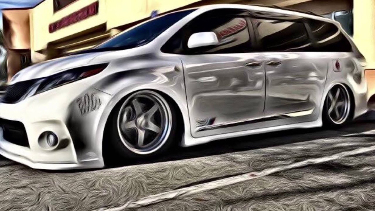 Silver Toyota Sienna slammed to the ground, low front three-quarter angle