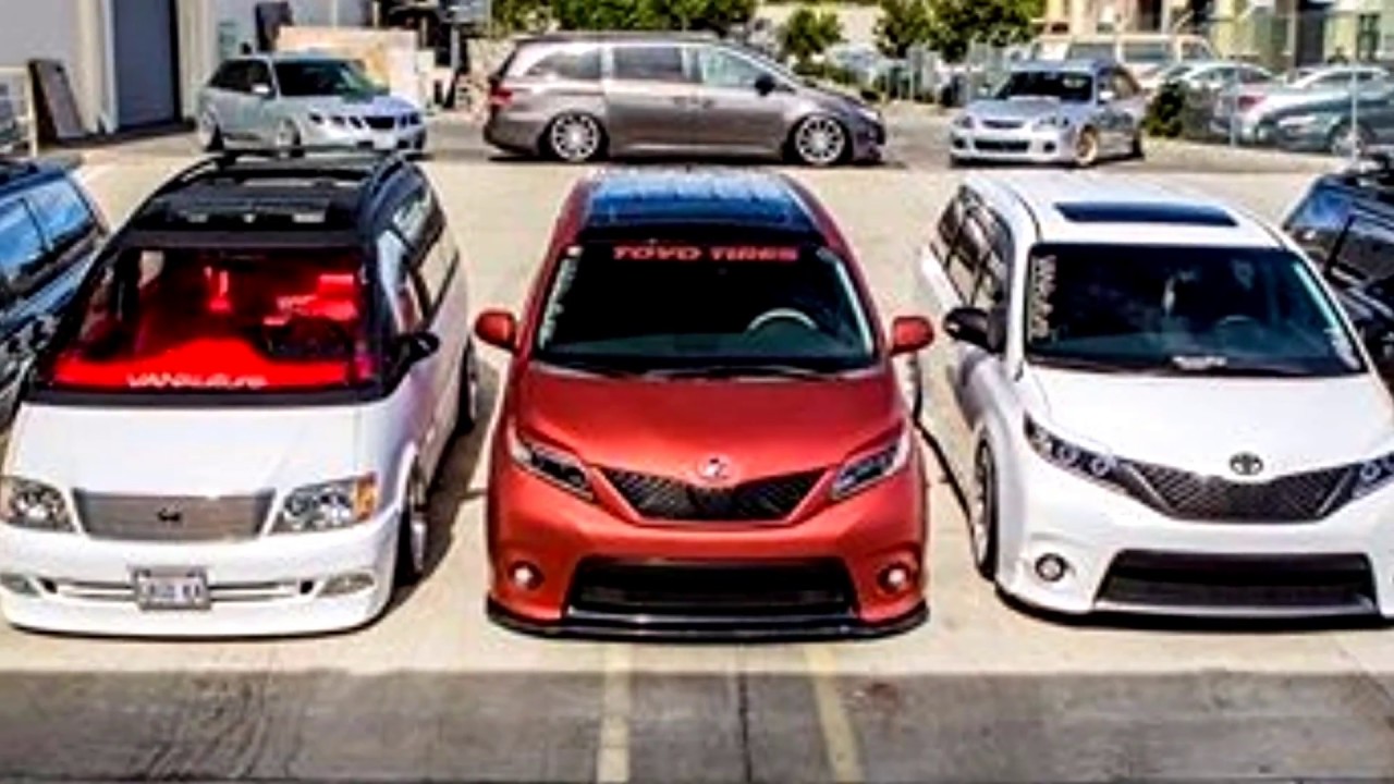 Three Vankulture vans parked front-to-camera